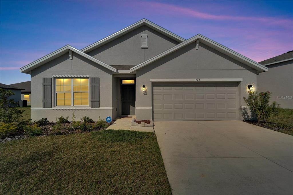 a front view of a house with garage