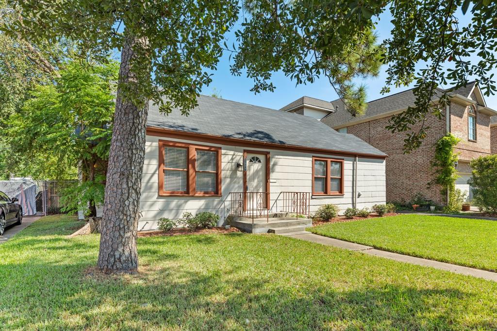 View of front of house with shade from good size tree.