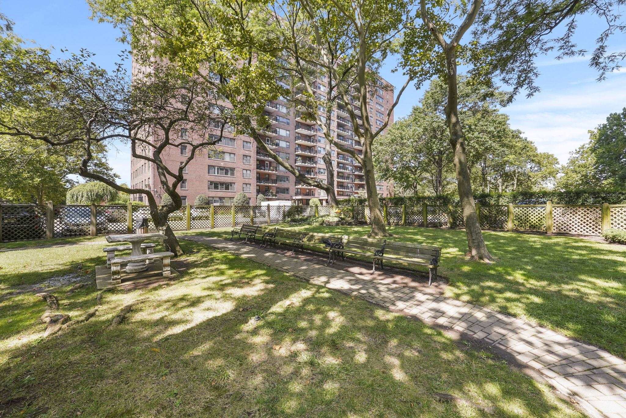 a backyard of a building with trees