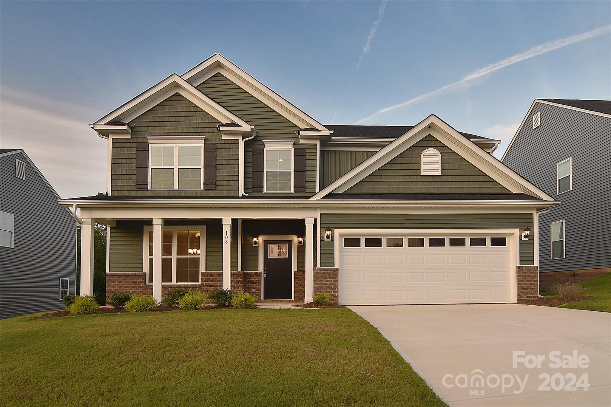 front view of a house with a yard