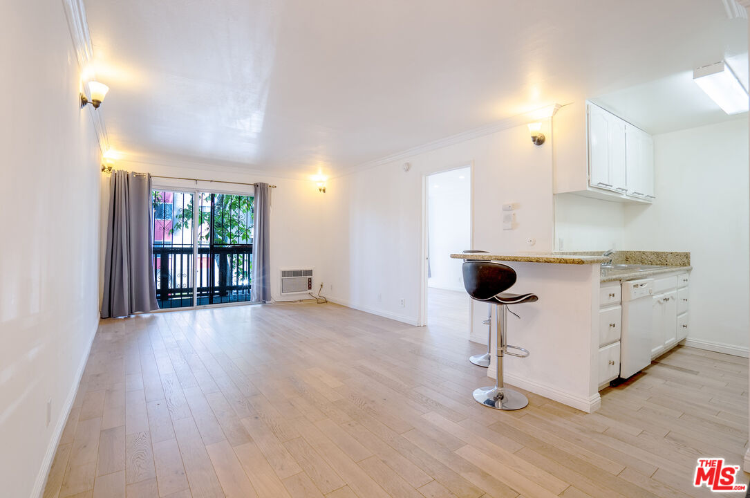 a kitchen with a table and chairs in it