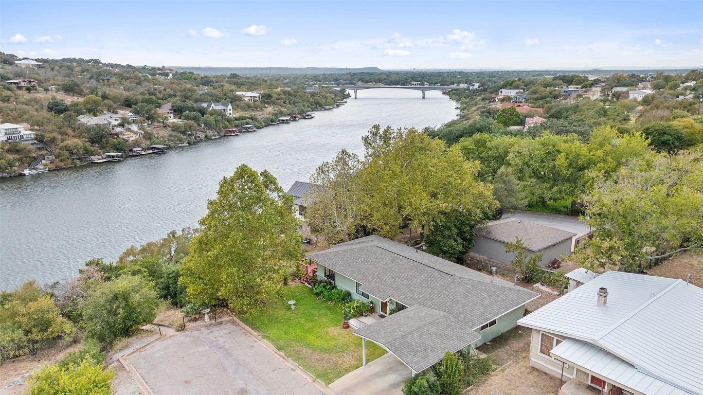 an aerial view of a house with a lake view