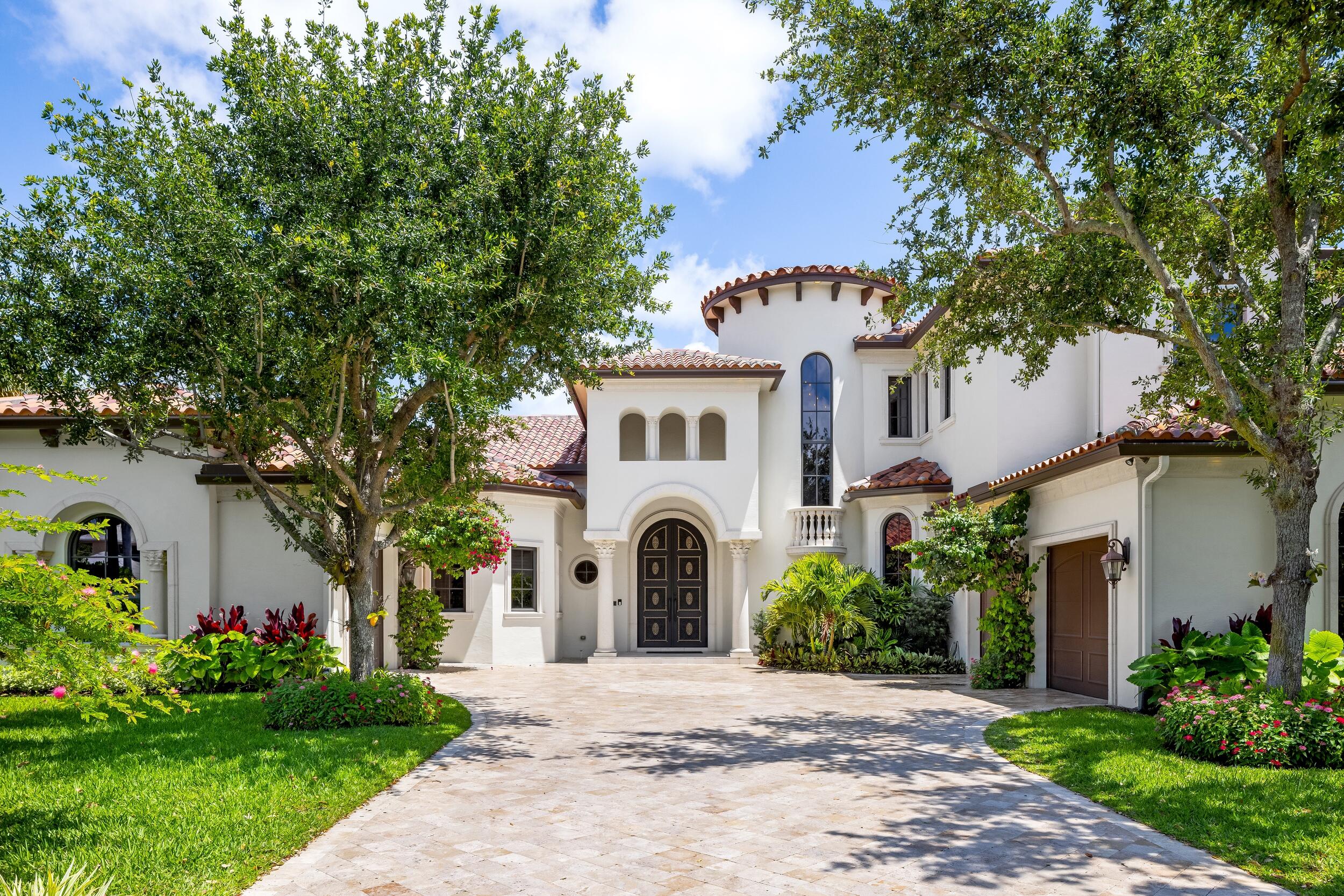 a front view of a house with garden