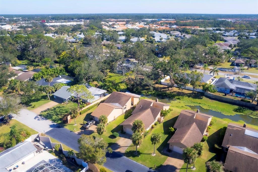 an aerial view of residential houses with outdoor space