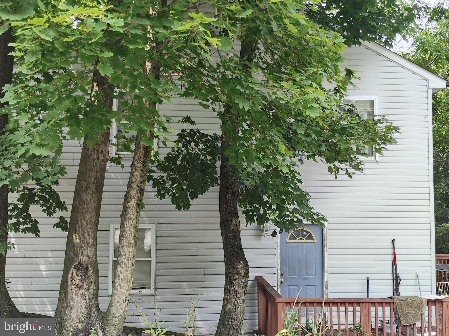 a view of a house with a tree