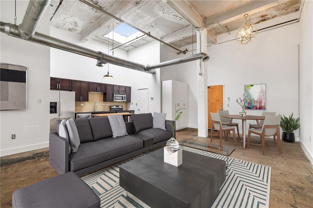 a living room with furniture and a table