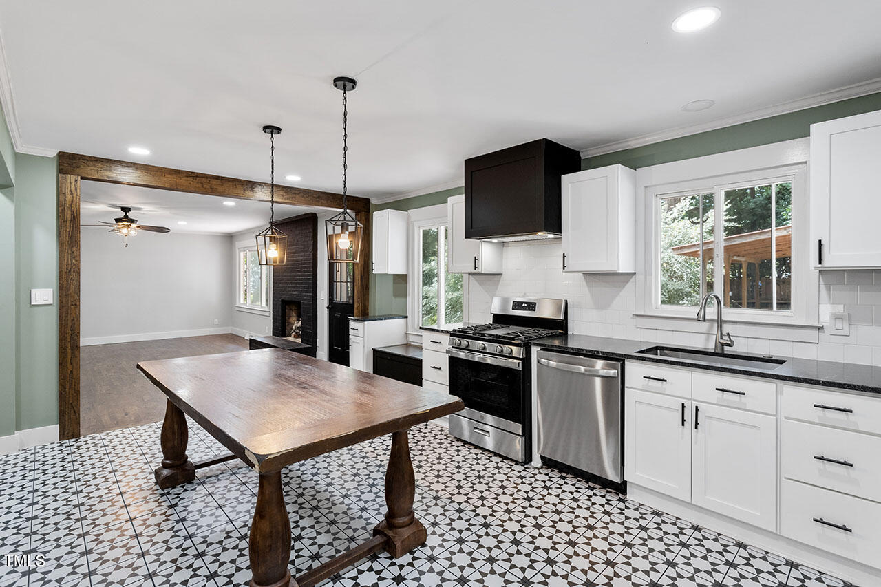 a kitchen with sink cabinets and stove