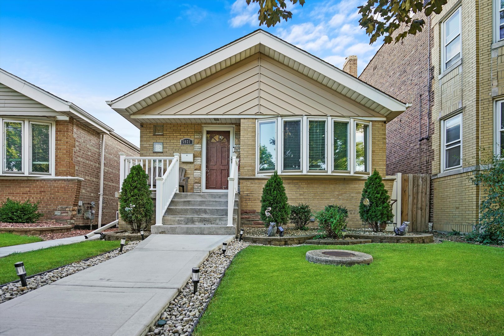 front view of a house with a yard