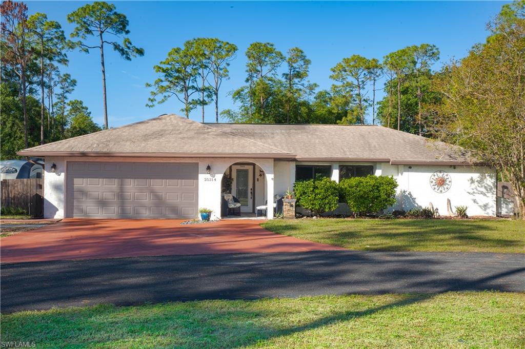 Ranch-style house property boasts an acre and a quarter of agrigultural living while minutes from city living.