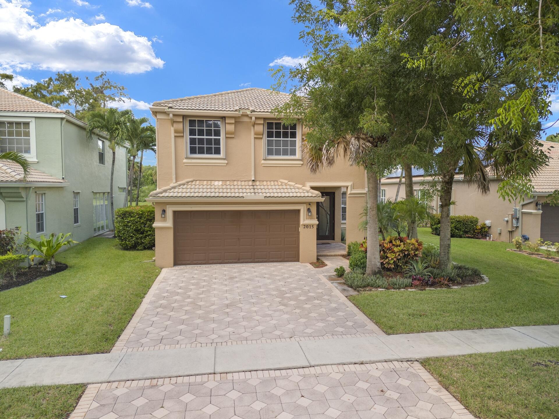 a front view of a house with yard