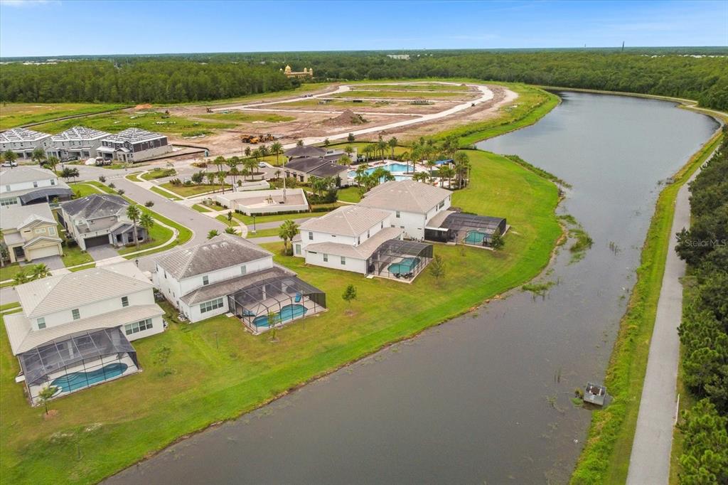 an aerial view of residential houses with outdoor space