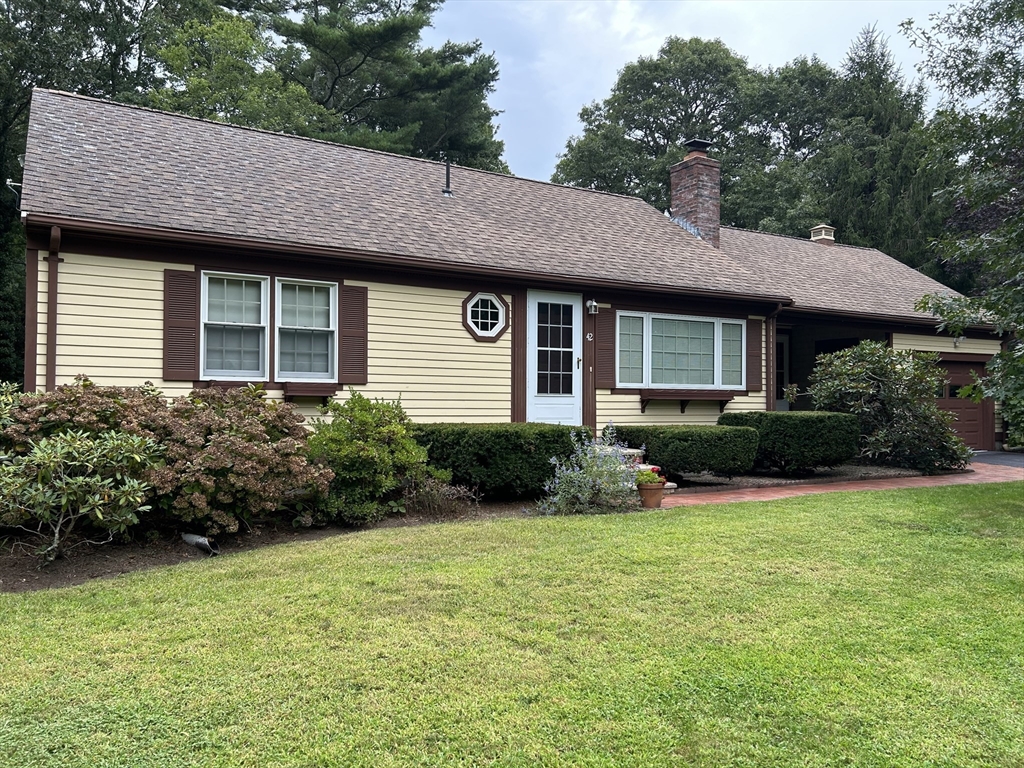 a view of a house with garden and yard