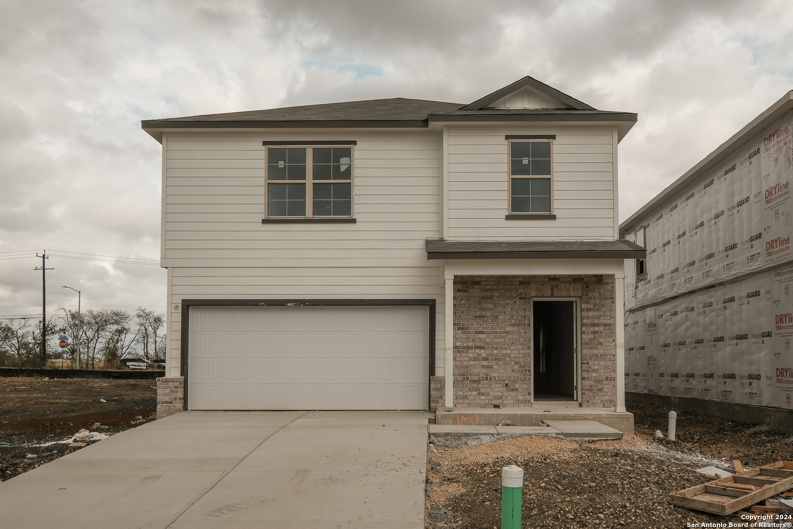 a front view of a house with a garage