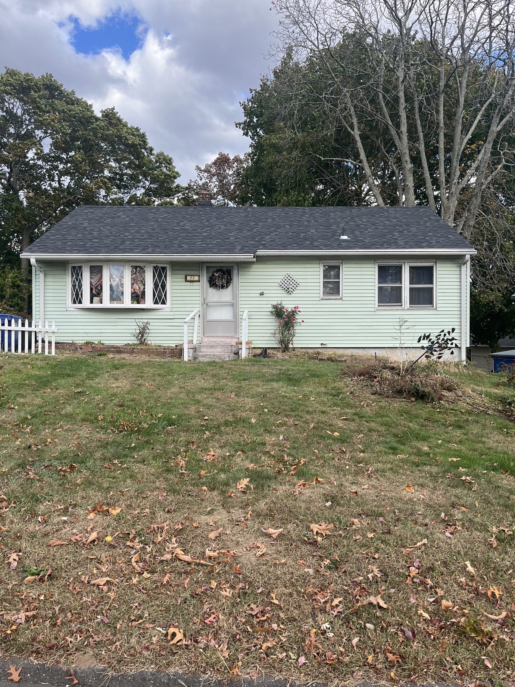 front view of a house with a yard