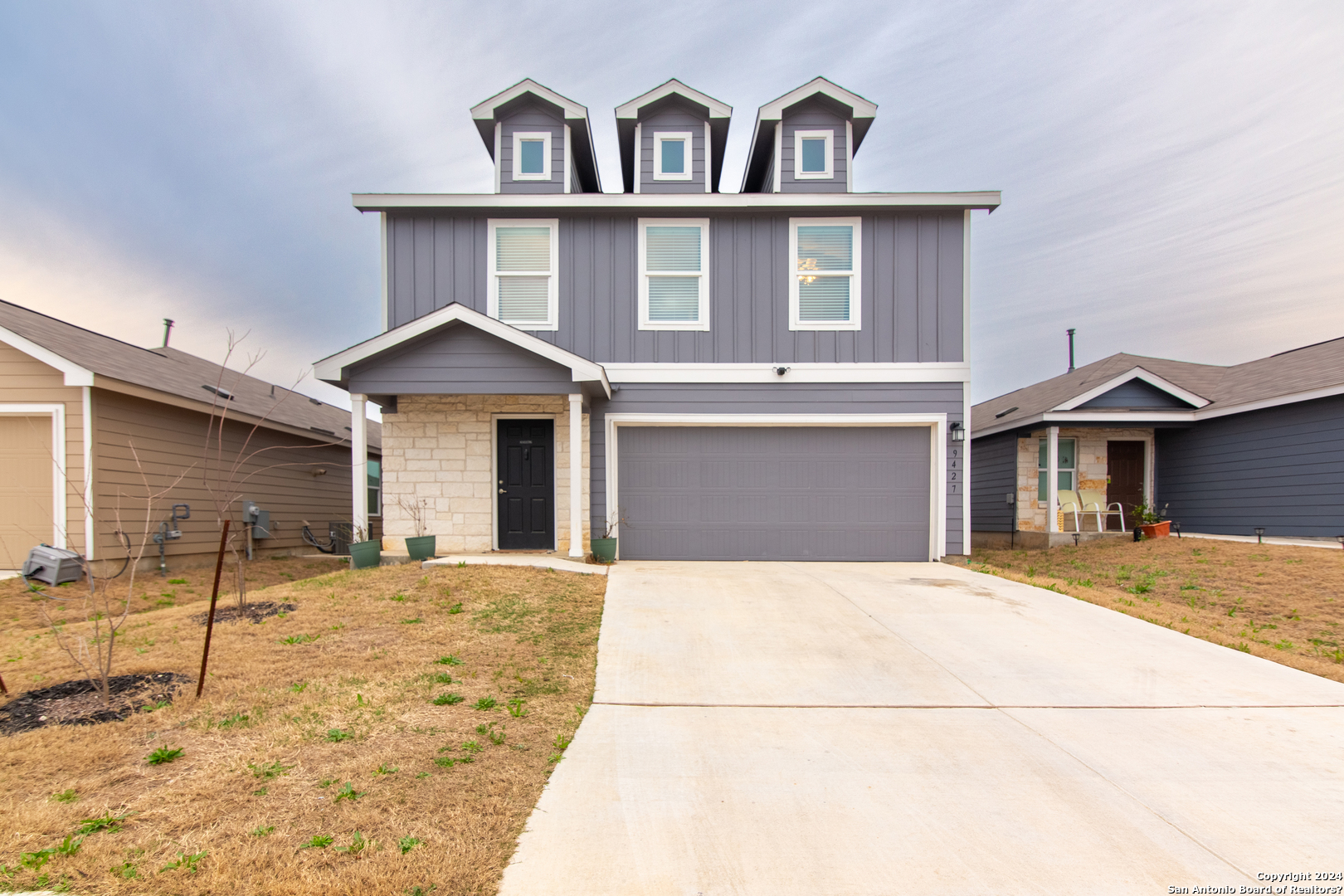 a front view of a house with a yard