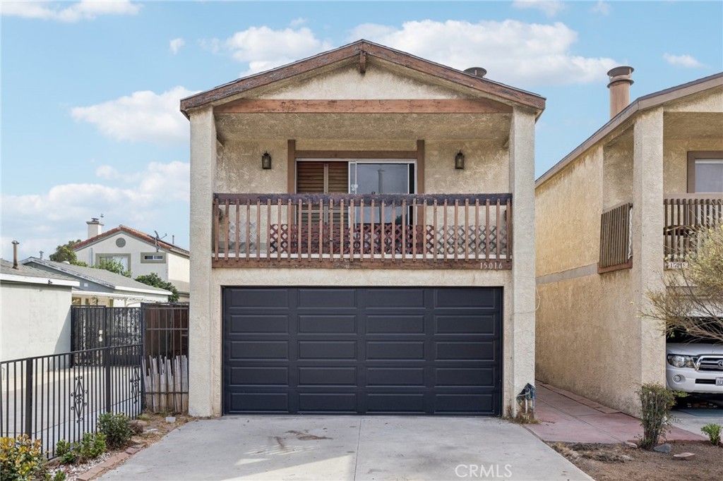 a front view of a house with a garage