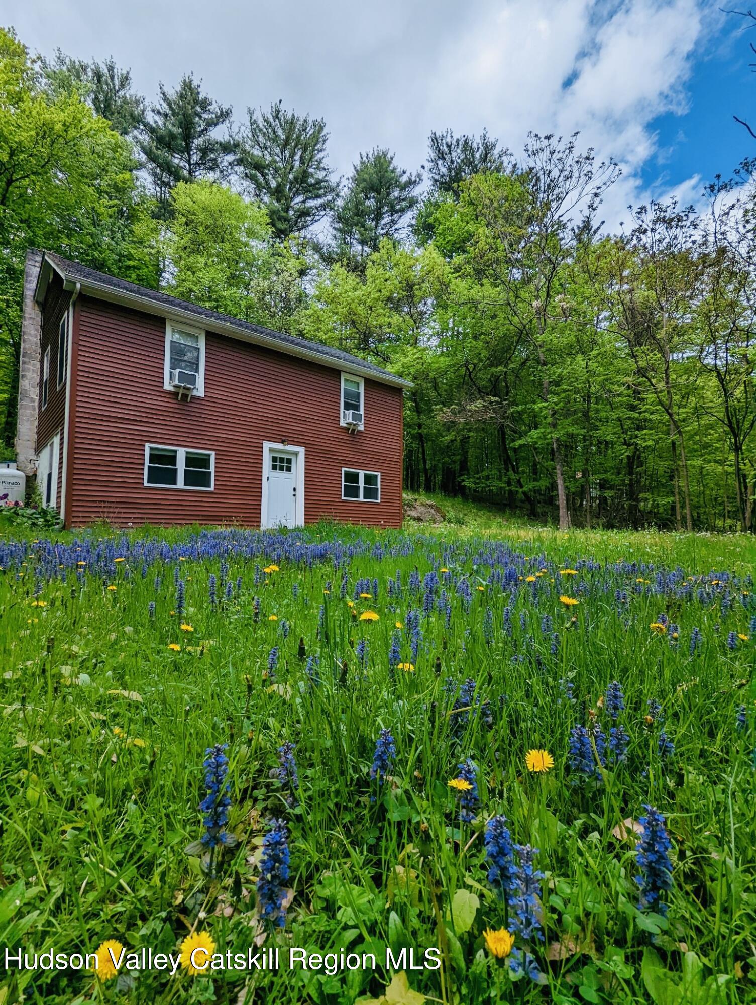 a house view with a garden space