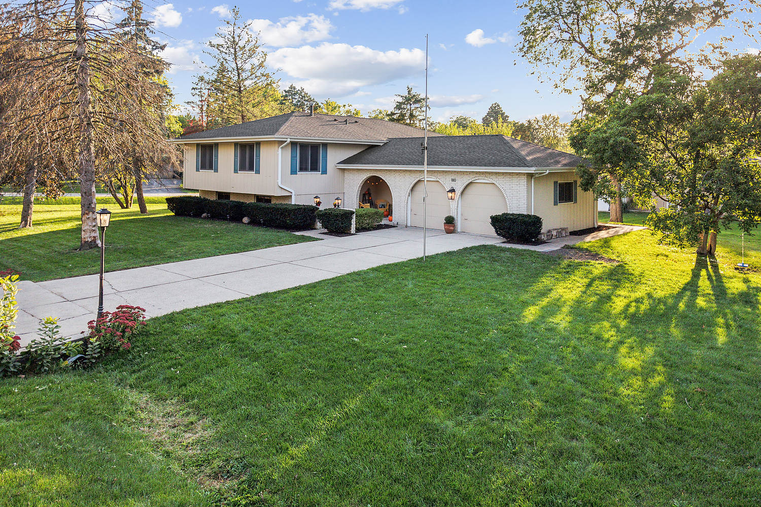 a front view of a house with garden