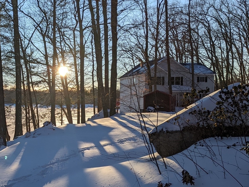 a view of a house with a snow on the road