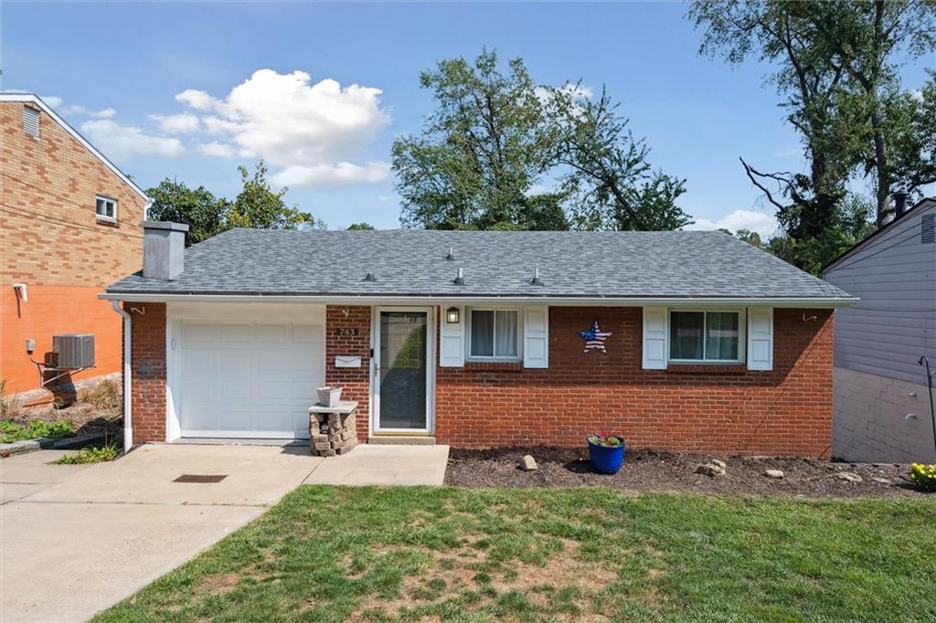 front view of a house with a yard