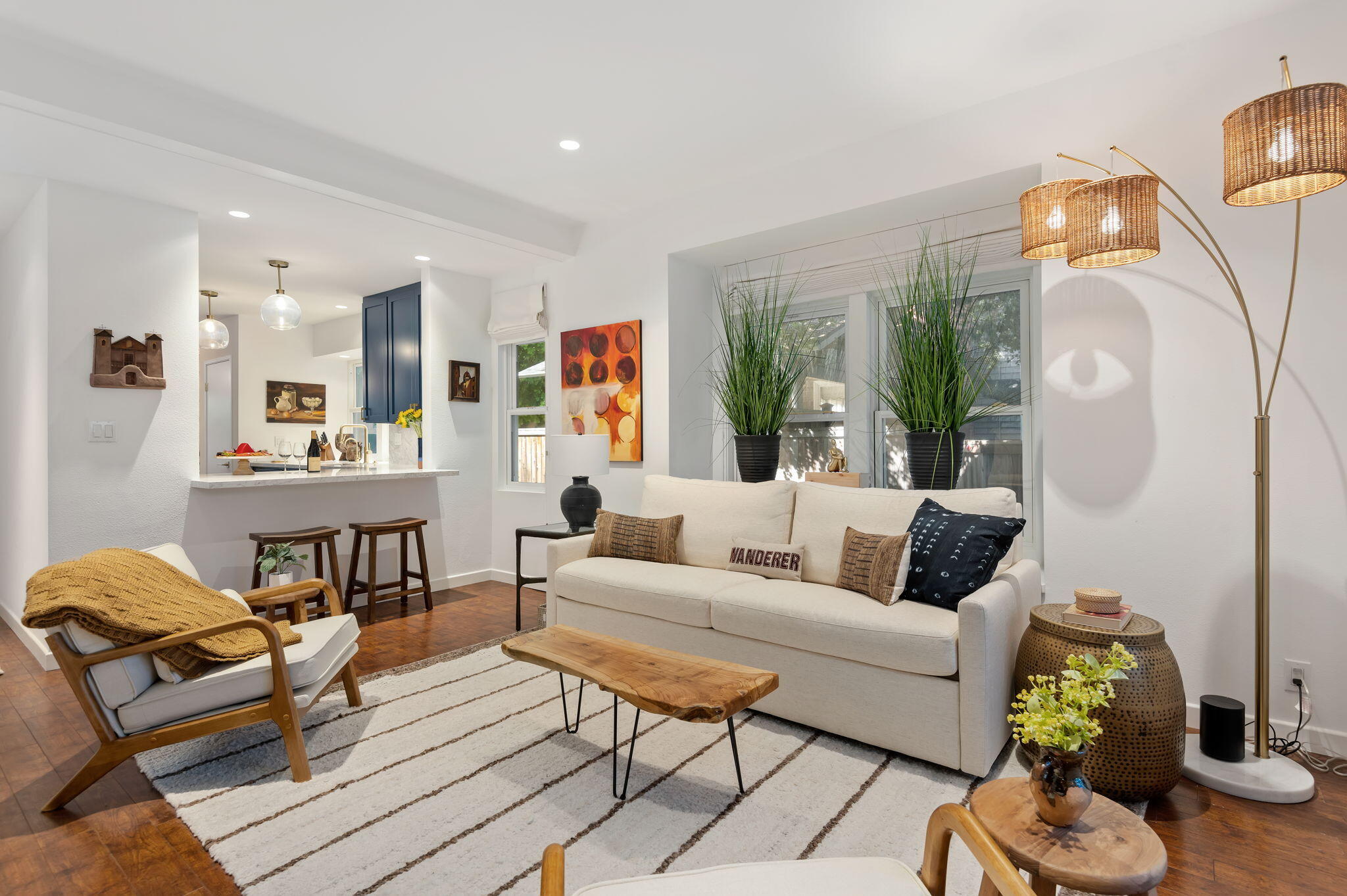 a living room with furniture and wooden floor