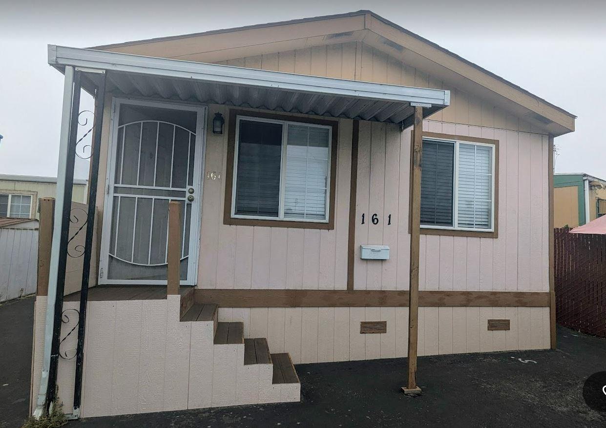 a front view of a house with a garage