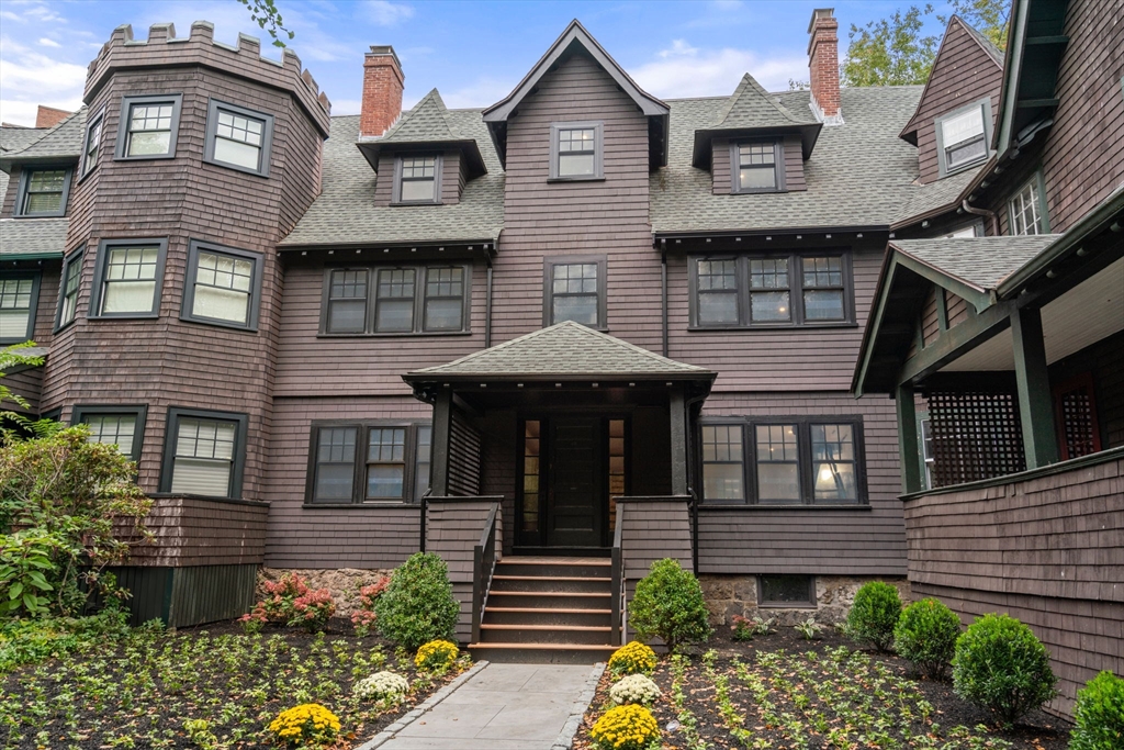 a front view of a house with garden