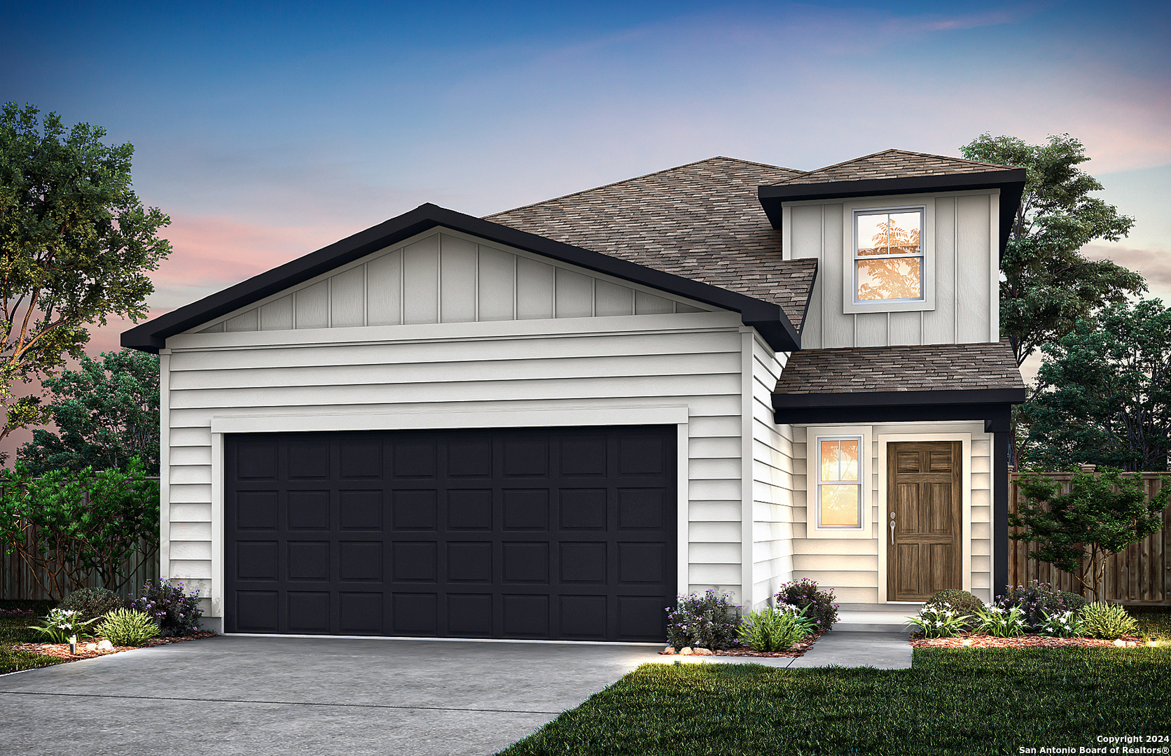 a front view of a house with a yard and garage