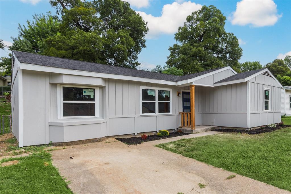 a house with trees in the background