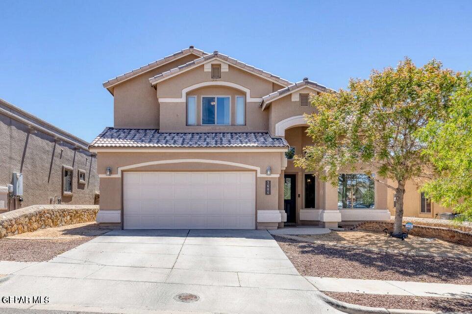 a front view of a house with a garage