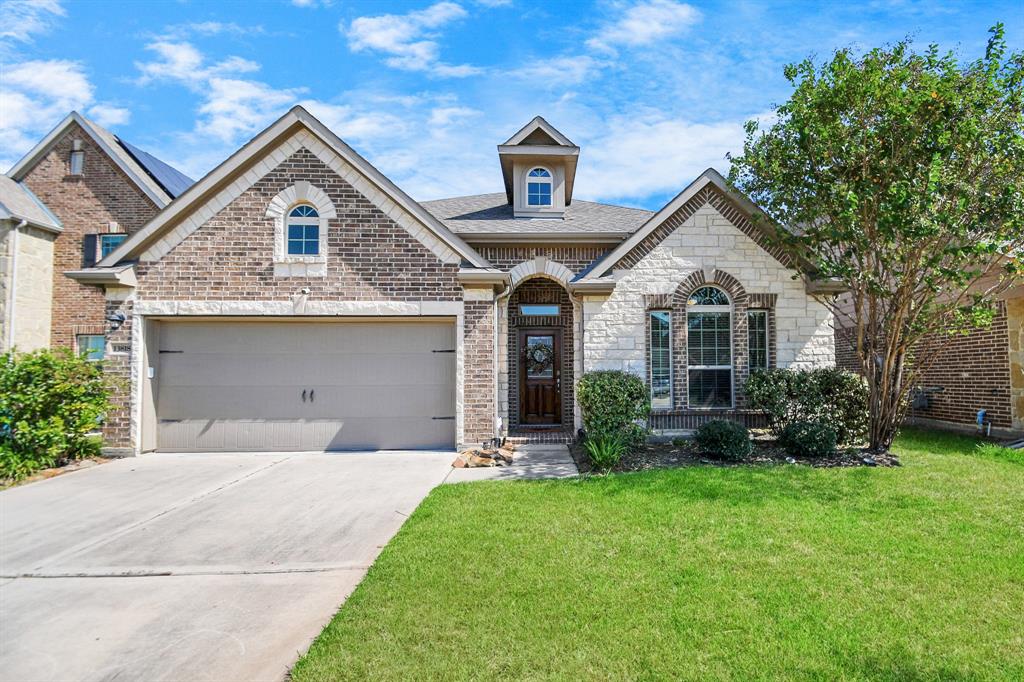 Discover your dream home! This elegant single-story residence boasts a charming brick exterior, a welcoming entryway, and manicured lawn. Embrace comfort in a neighborhood you'll be proud to call home.