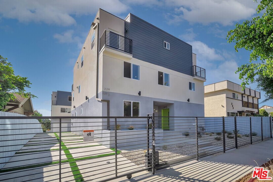 a front view of a house with wooden stairs