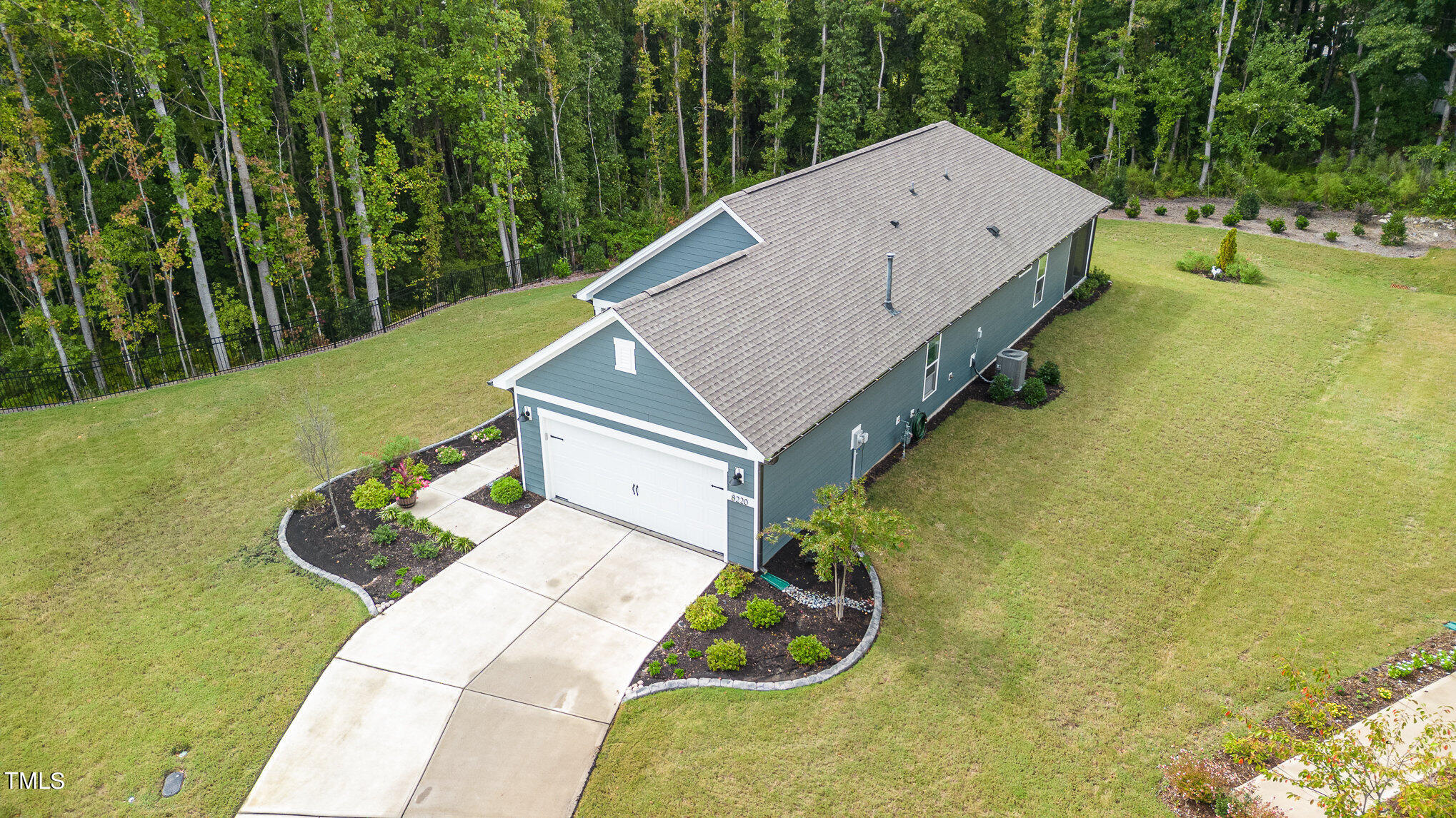 a aerial view of a house with pool