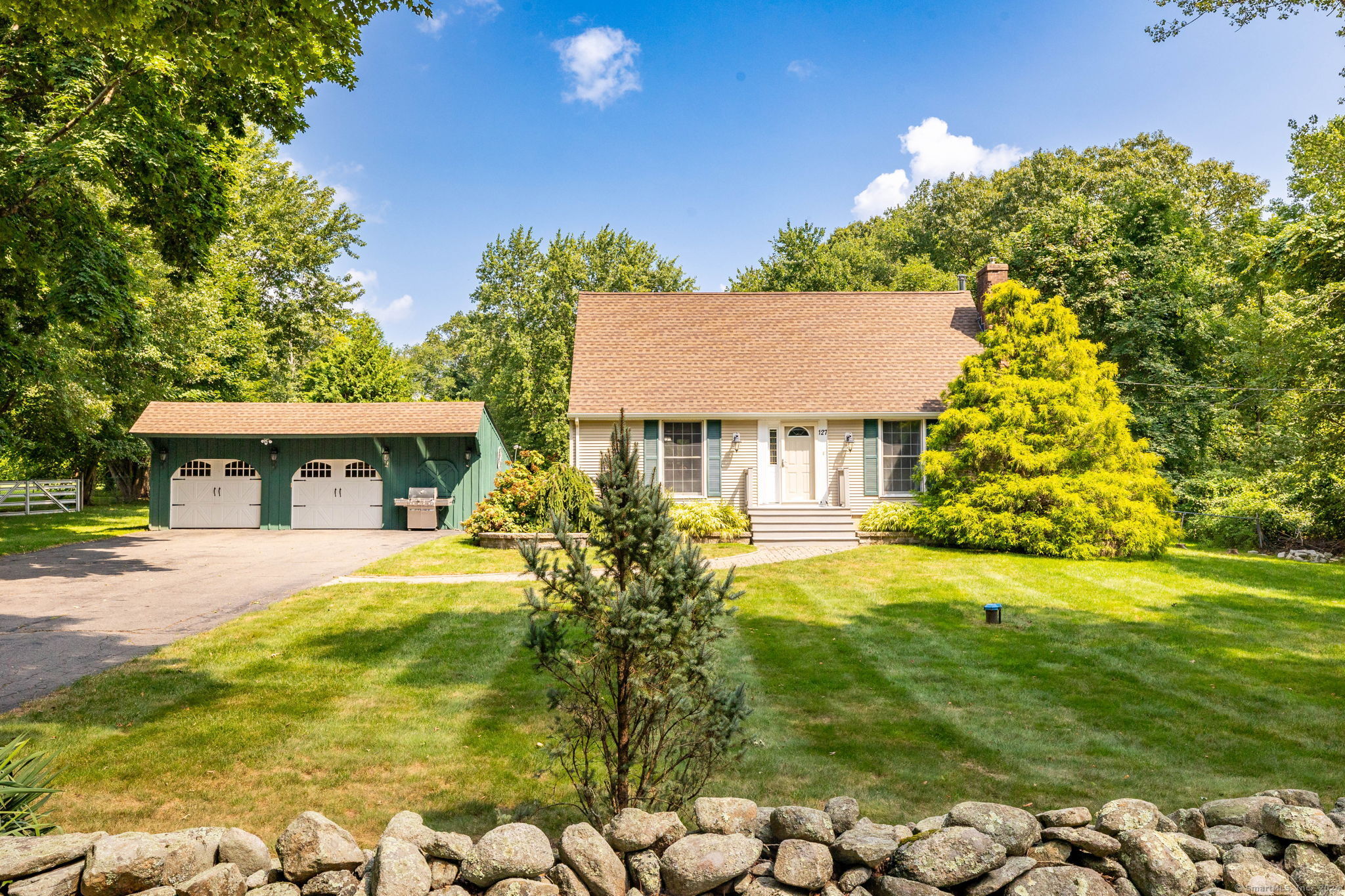 Welcome to 127 West St., in beautiful Hebron! This 3 Bedroom Cape sits on a level 1-acre lot just down the street from 2 golf courses!