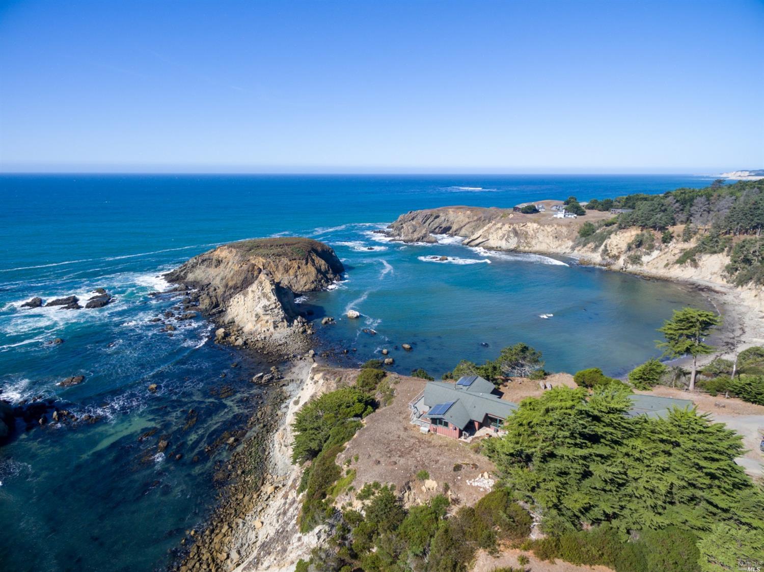 an aerial view of beach and ocean