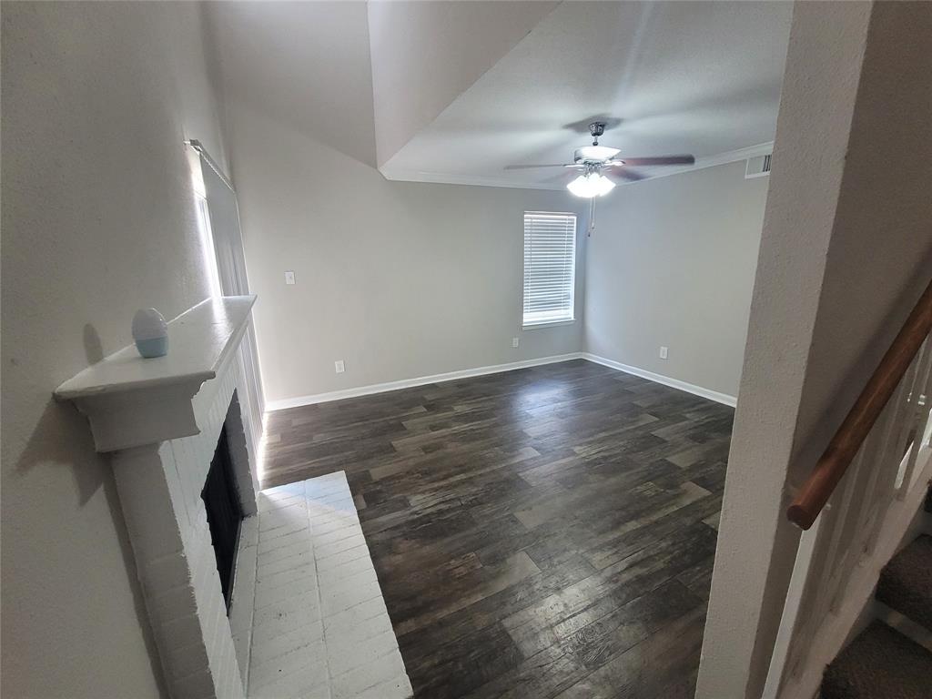 wooden floor in an empty room with a mirror