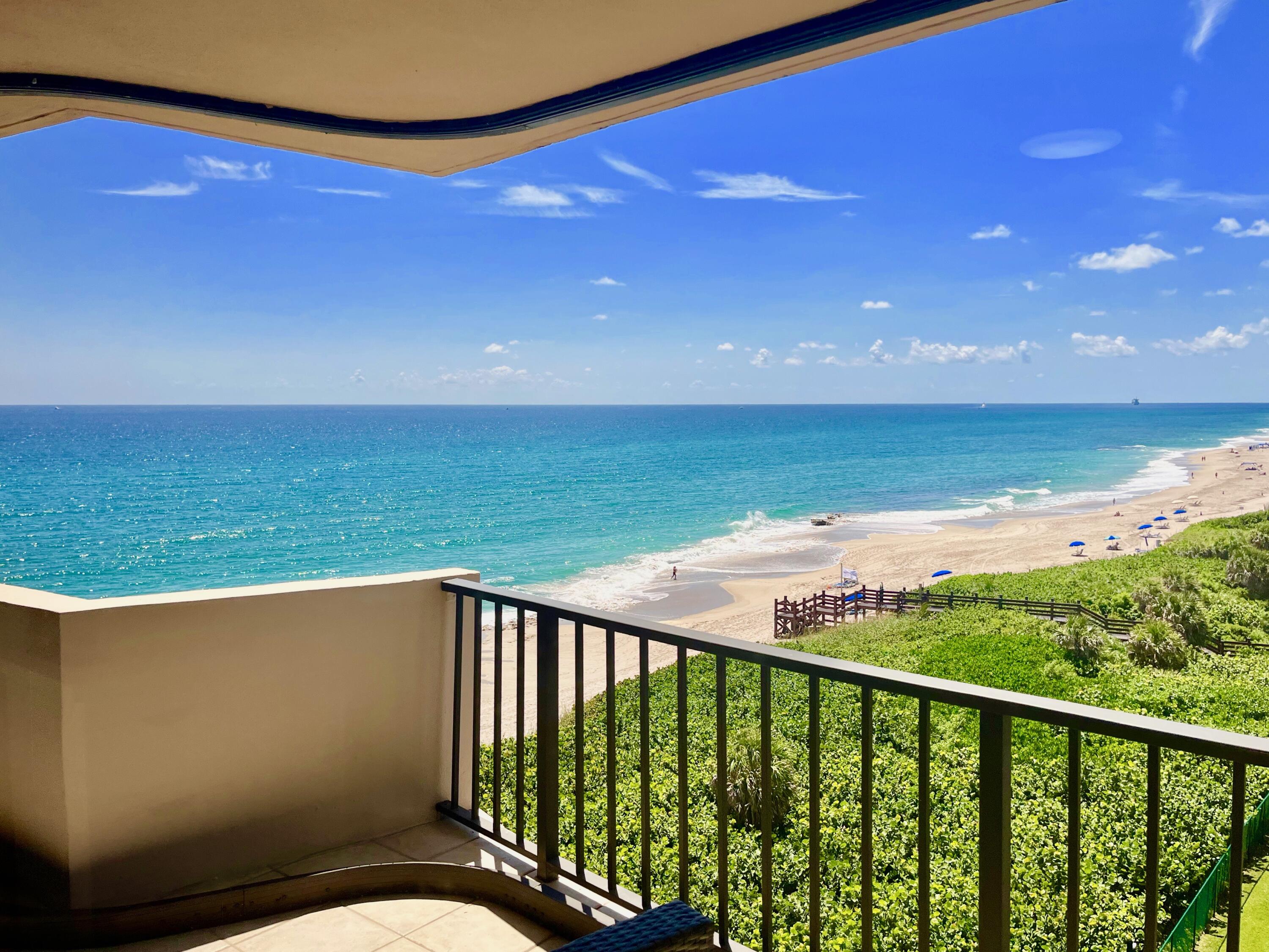 a balcony with an ocean view