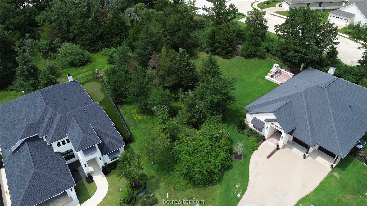 an aerial view of a house with outdoor space and street view