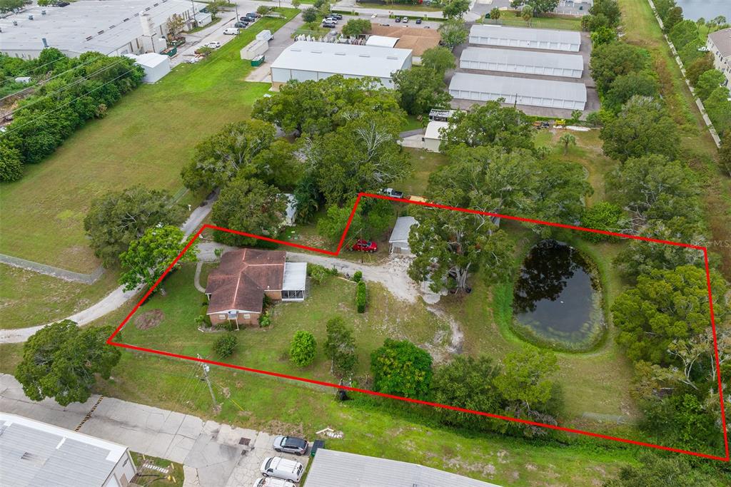 an aerial view of house with yard swimming pool and outdoor seating