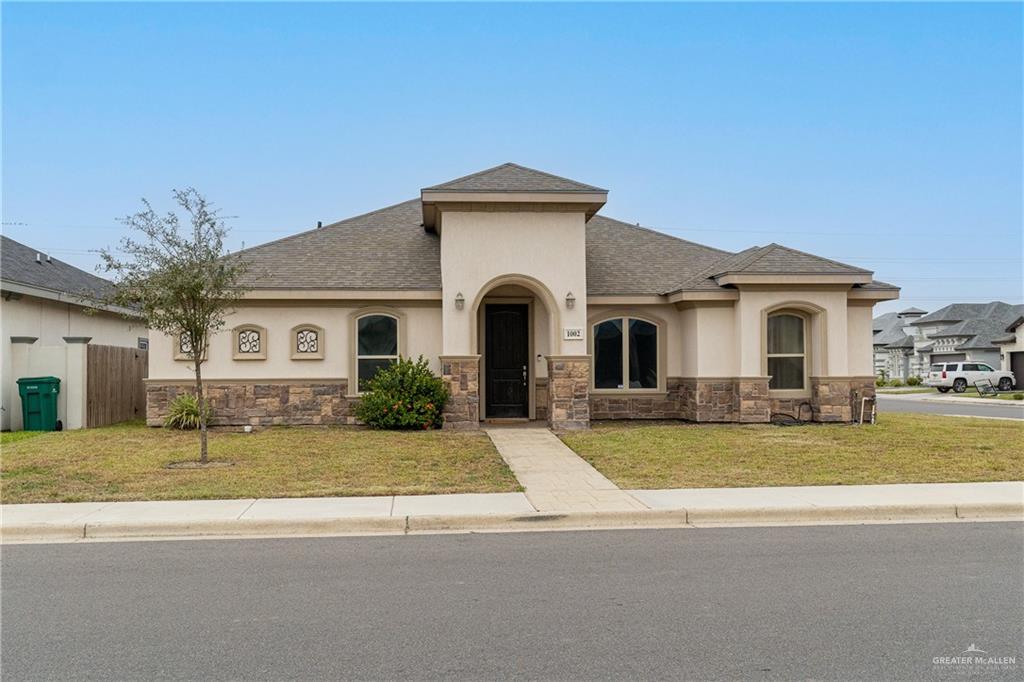 View of front of house with a front yard