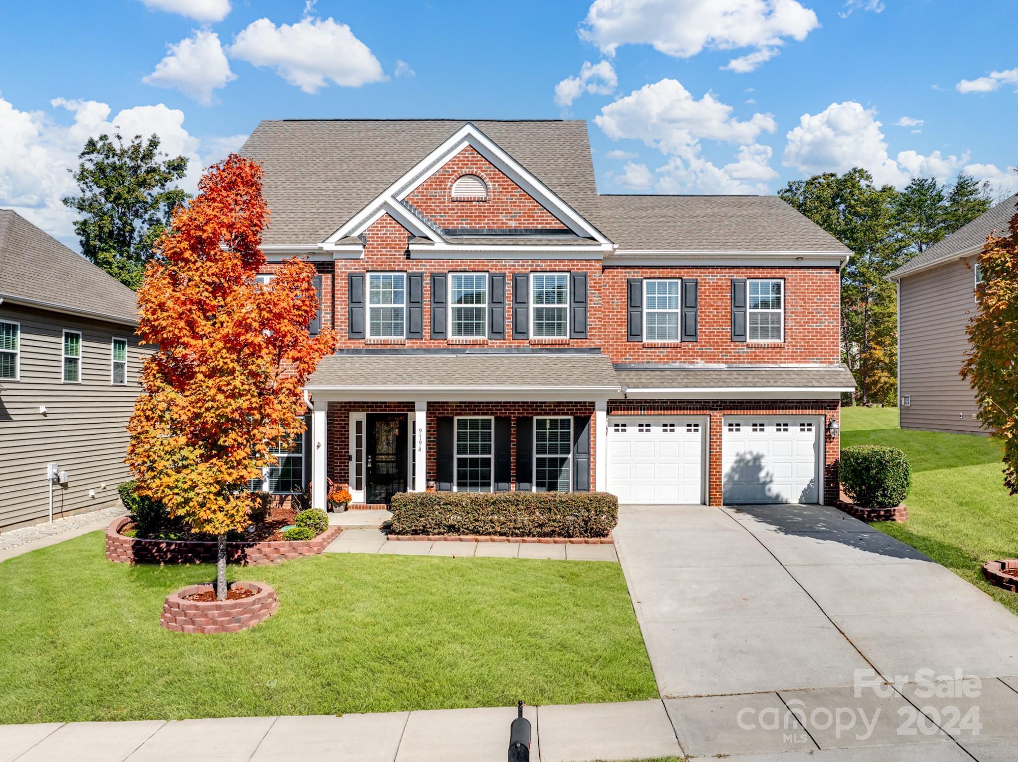 front view of a house with a yard