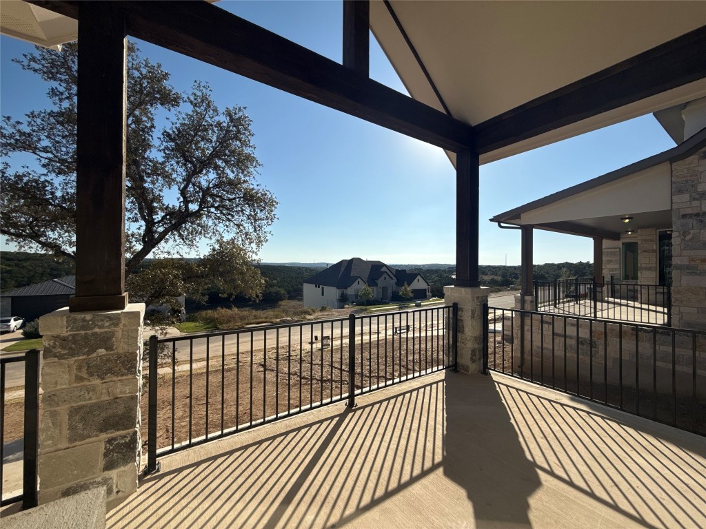 a view of a balcony with wooden floor