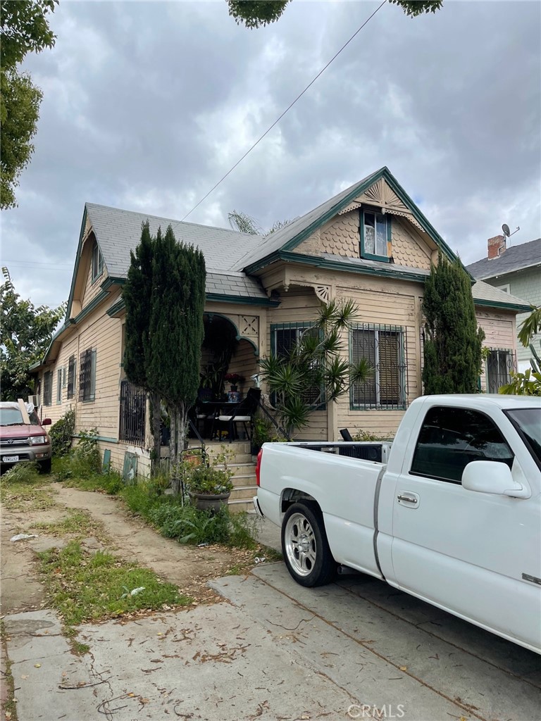 a view of a car parked in front of a house