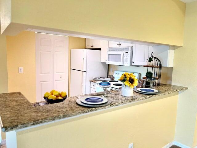 a kitchen with a sink and appliances