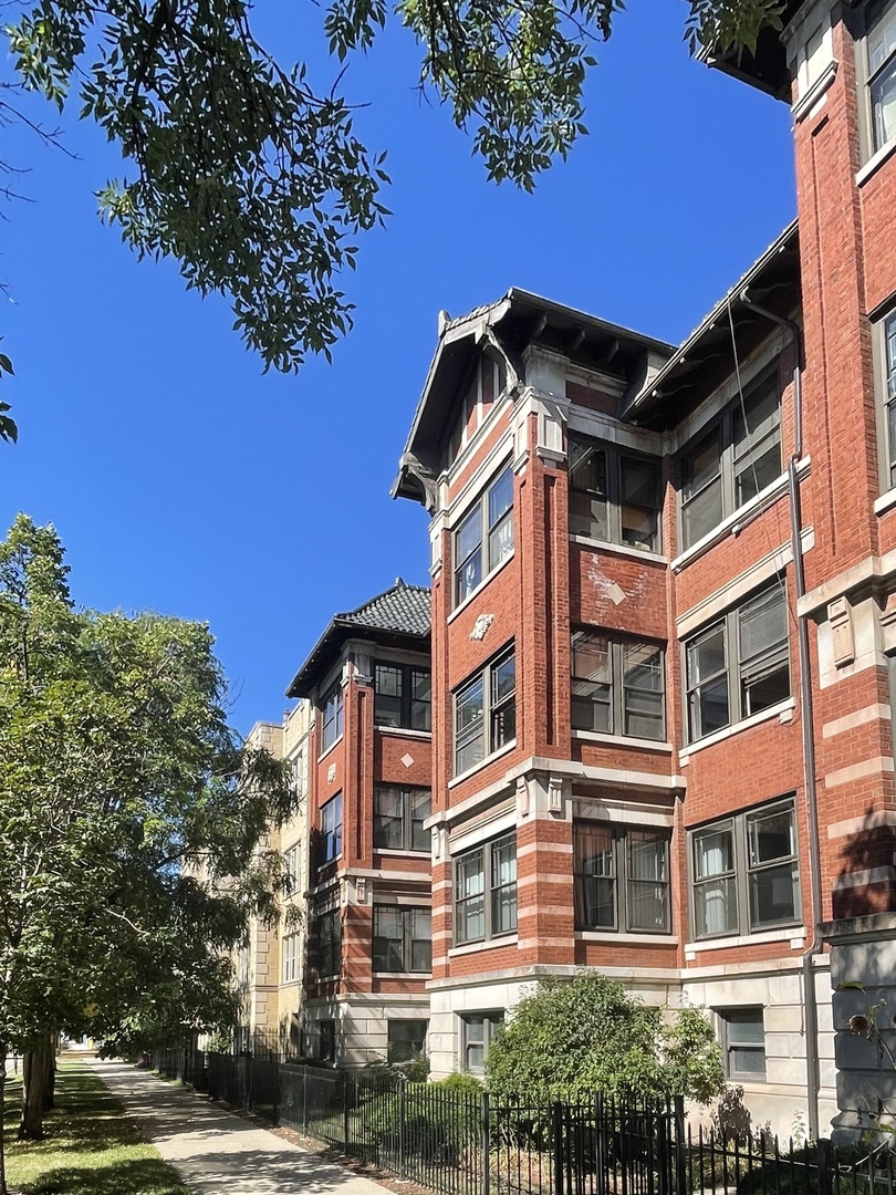 a view of a building with a tree