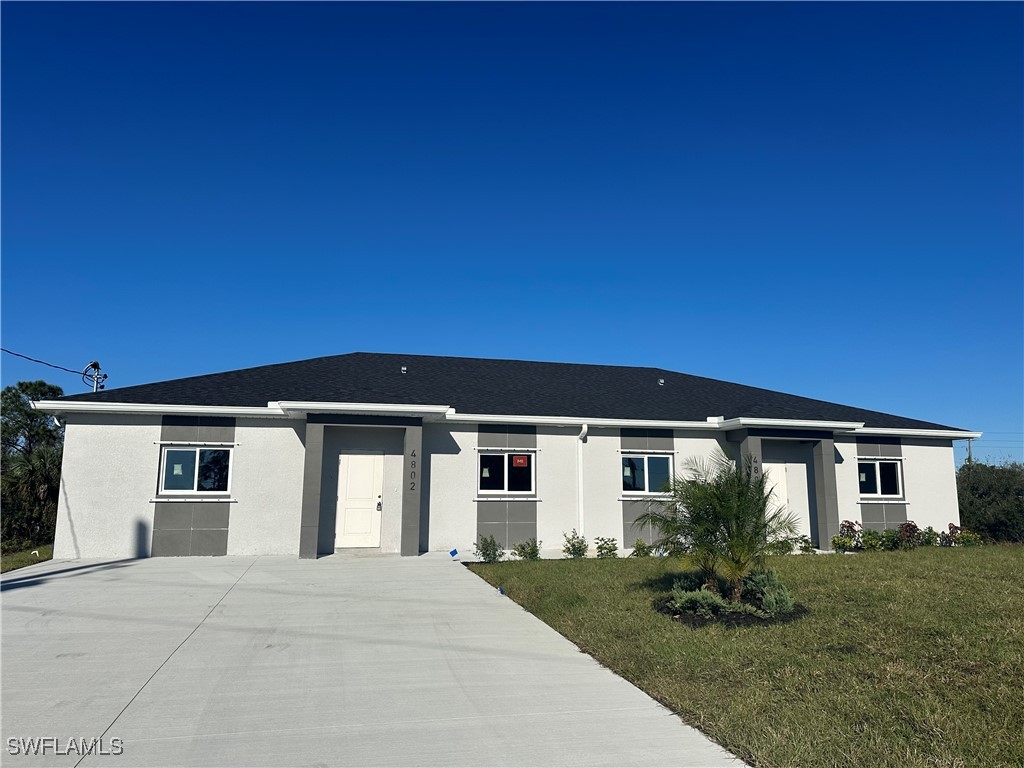 front view of a house with a yard