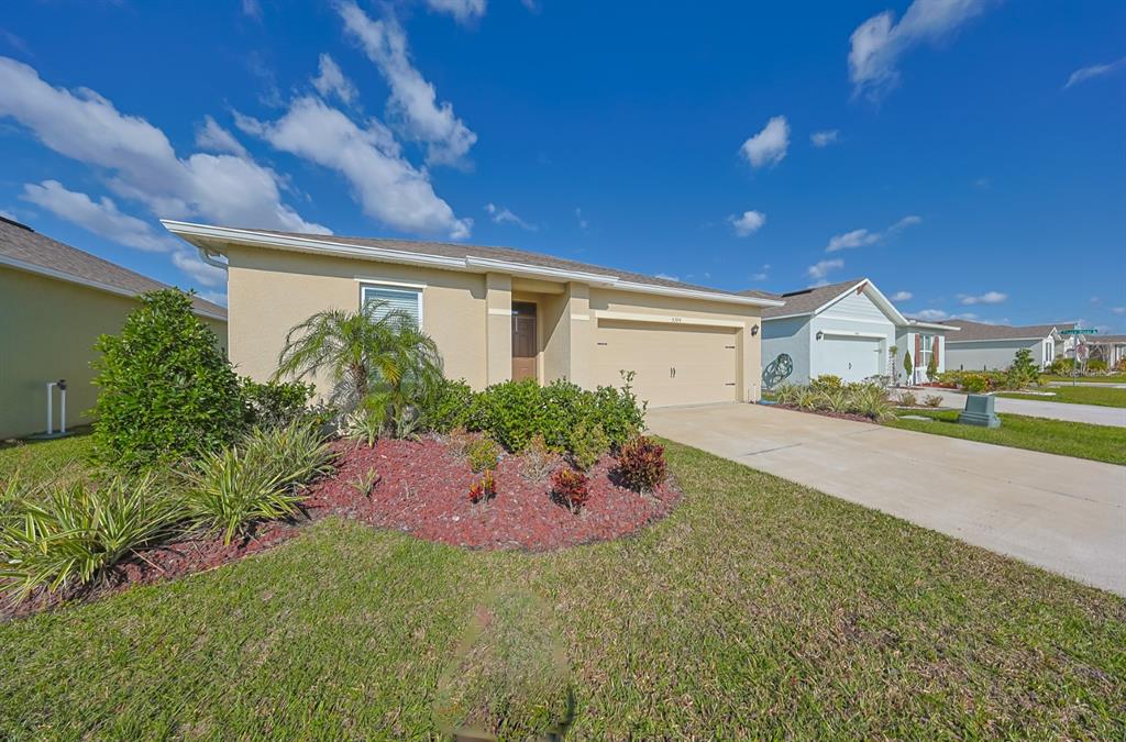 a front view of house with yard and outdoor seating