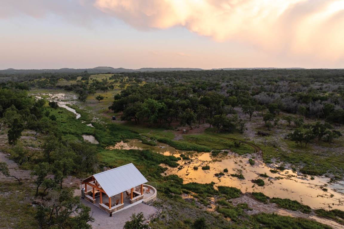 an aerial view of a house with a garden