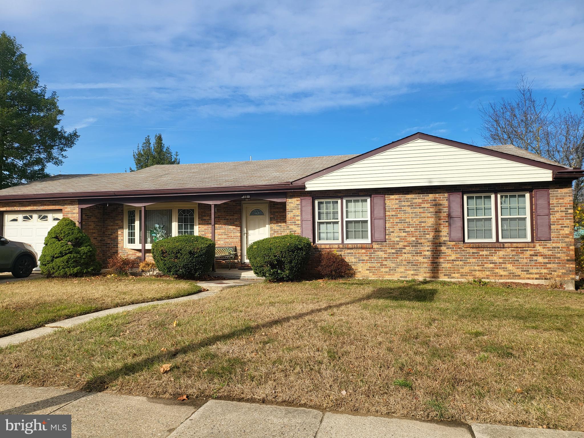 a front view of a house with yard porch and furniture