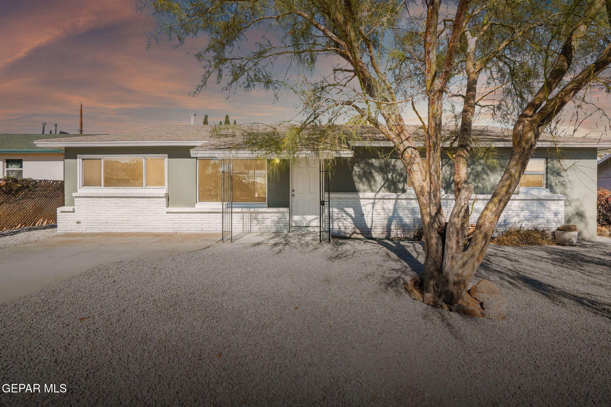 a view of a house with a yard and garage